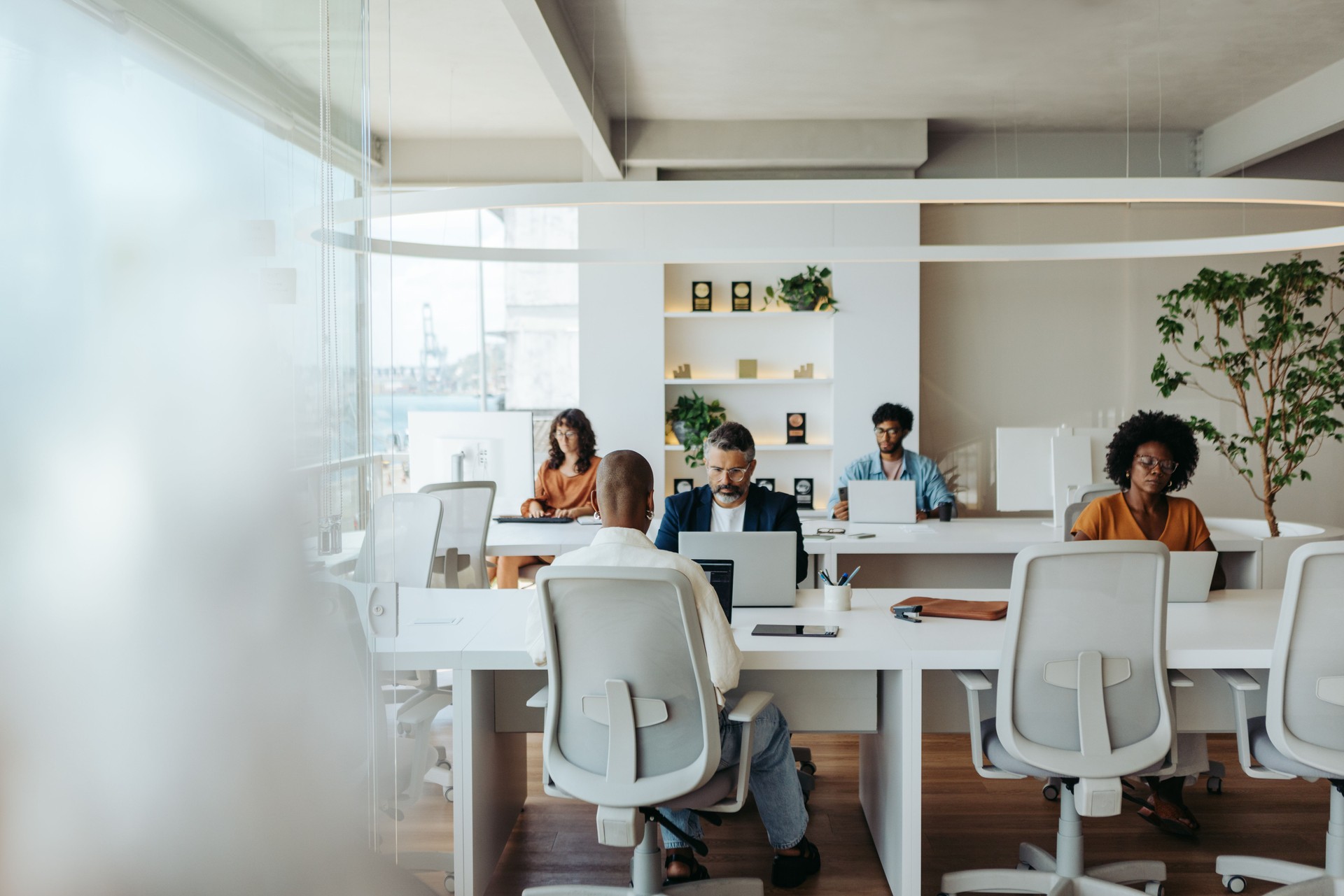 Multicultural colleagues working together in a creative coworking office